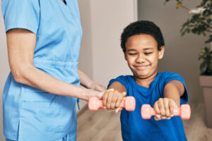 Physical Therapist Working with Child in Their Home