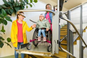 Family Helping Girl with Cerebral Palsy Down Stairs