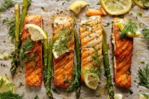 Baked Salmon with Asparagus with Lemon and Dill on Parchment Paper 