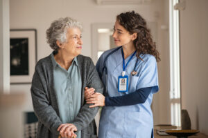 At home caregiver assisting senior patient
